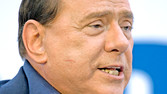 [A Pesky Paparazzo Stalks the Wily Berlusconi]